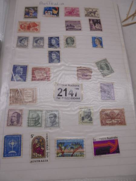 A large folder of UK stamps up to 2000 and a large folder of world stamps.