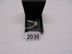 A stylish four stone 18ct gold designer ring, size M half, 2.7 grams.