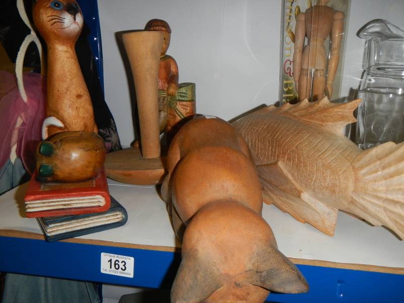 A wooden fish and wooden cats etc.,