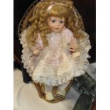 A porcelain doll in wicker chair