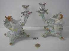 A pair of good 20th century cherub dishes with candleholders.