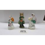 A Beswick Beatrix Potter 'Simkin' figure and two other small figures.