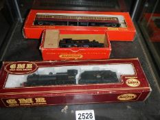 A boxed Triang Hornby locomotive, a boxed carriage and a boxed Airfix locomotive.