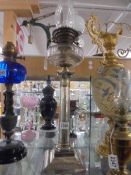 A Victorian Elkington silver plated column oil lamp with Hinks font and burner. COLLECT ONLY.