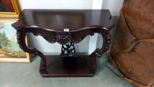 A 20th century mahogany hall table. COLLECT ONLY.