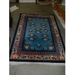 A vintage Persian blue wool rug, Approximately 128 x 178 cm, COLLECT ONLY.