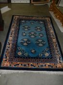 A vintage Persian blue wool rug, Approximately 128 x 178 cm, COLLECT ONLY.