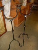 A pair of tall metal candleholders, COLLECT ONLY.