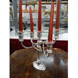 A silver plate candelabra.