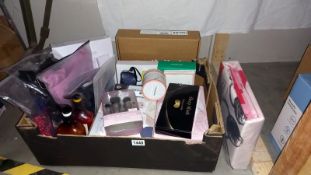 A quantity of 'new' women's items including make up brushes, tops, gift box, etc