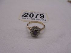 A 9ct gold cluster ring, size O half, 1.8 grams.