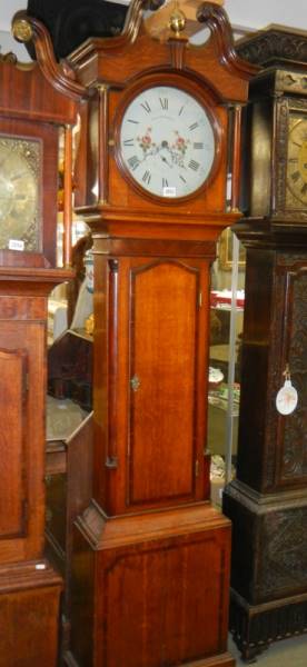 A good oak cased 30 hour long case clock in working order, COLLECT ONLY.