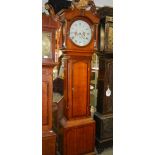 A good oak cased 30 hour long case clock in working order, COLLECT ONLY.