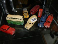A quantity of play worn die cast models including buses, fire engine etc.,
