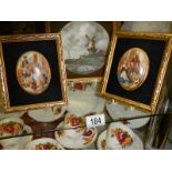 Two gilt framed oval plaques and a gilt framed windmill scene.