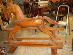 A 20th century mahogany rocking horse, COLLECT ONLY.