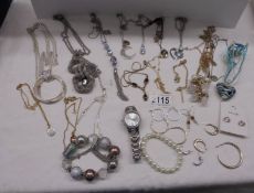 A mixed lot of pendants, necklaces etc.,