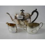 A three piece silver plate tea set.