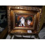 An oil on board of cat in gilt wood frame, image 11.5cm x 16cm, frame 30cm x 26cm