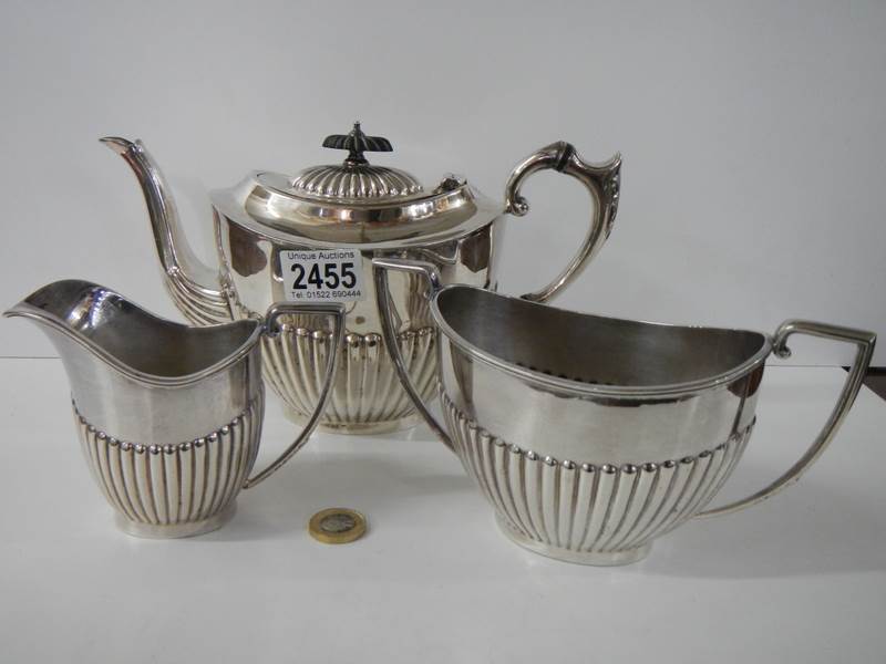 A three piece silver plate tea set, J T & Co.,