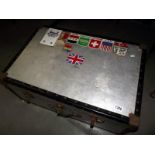 A well travelled large vintage aluminium travel trunk with world location stickers 50cm x 77cm x