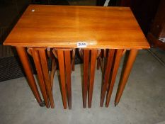 A nest of four teak drop side tables, COLLECT ONLY