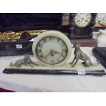A French art deco mantel clock surmounted dogs, COLLECT ONLY.