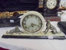 A French art deco mantel clock surmounted dogs, COLLECT ONLY.