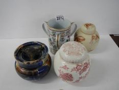 A ceramic tobacco jar, three handled tankard and two ginger jars.