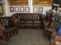 A deep buttoned three peice suite comprising Chesterfield sofa, Chesterfield chair & wing arm chair