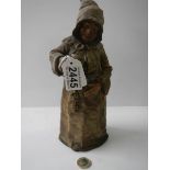A 19th century stoneware bell in the shape of a monk, (no clanger).