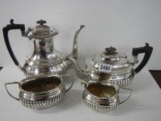 A four piece silver plate tea set.