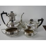 A four piece silver plate tea set.