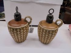 A pair of 19th century basket weave stoneware whisky and brandy flagons, 18cm tall to top of loop.