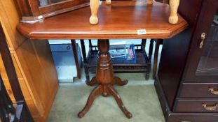 An octagonal mahogany tea table on centre column, 92cm x 61cm x 78cm high, COLLECT ONLY