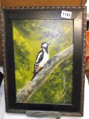 Oil on board of a great spotted woodpecker and a watercolour of one other