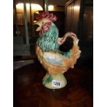 A glazed pottery jug in form of a cockerel height 29cm