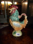 A glazed pottery jug in form of a cockerel height 29cm
