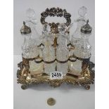 A Victorian silver plate and glass eight piece condiment set,