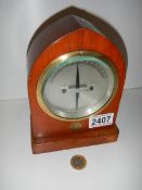 A brass bound differential galvanometer by A.C.M of Liverpool, mounted in a solid wood steeple case