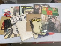 A quantity of rock records including Jeff Beck, The Rolling Stones, John Lennon, Deep Purple, Pink