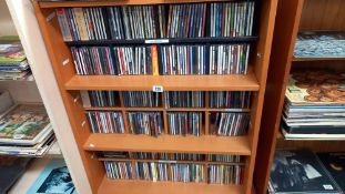 3 shelves of CDs including cabinet and shelves