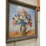 An oil on board painting of vase of flowers signed F Laurence, COLLECT ONLY.