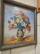 An oil on board painting of vase of flowers signed F Laurence, COLLECT ONLY.