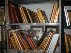 A large lot of pictures and frames on two shelves, COLLECT ONLY.