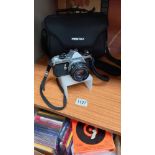 A Pentax ME super SLR camera + bag