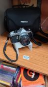 A Pentax ME super SLR camera + bag