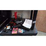 Atari CX 2600 game console with power lead, controllers and an array of game cartridges including