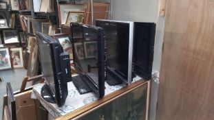 4 televisions , some with remotes