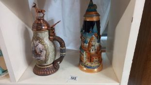 A Bradford exchange forest monarch stein and a German beer stein